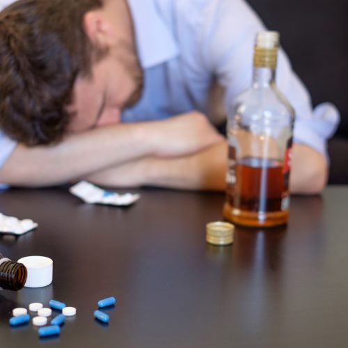 man-addicted-to-pills-and-alcohol